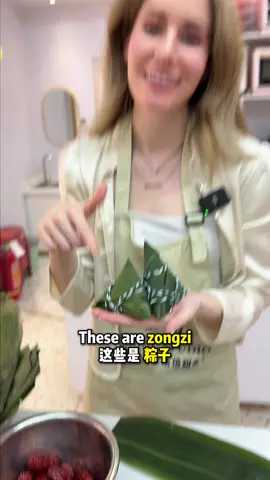 A post by @kristinlaoshi on TikTok caption: 包粽子 Making Zongzi. 端午节安康 Wish you good health for Loong Boat Festival! #英语 #English #learnenglish #Chinese #China #中文