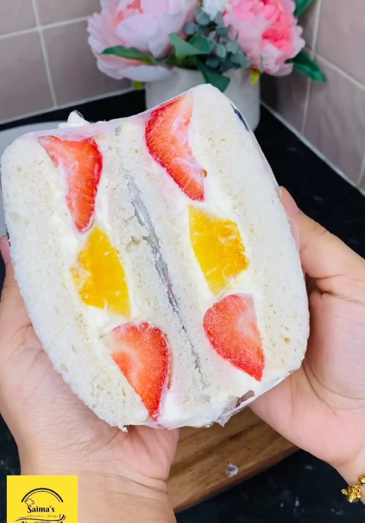 A post by @saimaafrosetonni on TikTok caption: Fruit sandwich 