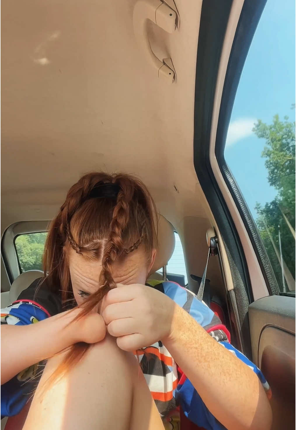 A post by @bionic_pippi on TikTok caption: didn’t finish my hair in time for @Intents Festival . And since people already don’t understand how I braid with one hand while standing still… here I am braiding in the car 🩵🦋 #intents #intentsfestival #hairinspo #braids #festivalhair 