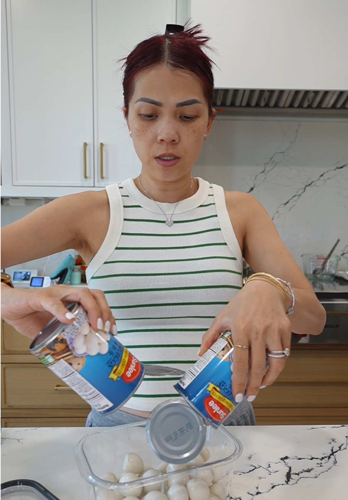 A post by @alissanguyen_ on TikTok caption: MAYAK EGGS (DRUGS EGGS)     2 can quail eggs (15 oz each) ½ cup soy sauce ½ cup water ¼ cup rice syrup 2 scallion, chopped 1 shallot, diced 1 fresno chili/ jalapeno, diced 1 TBSP garlic 1 TBSP sesame seeds