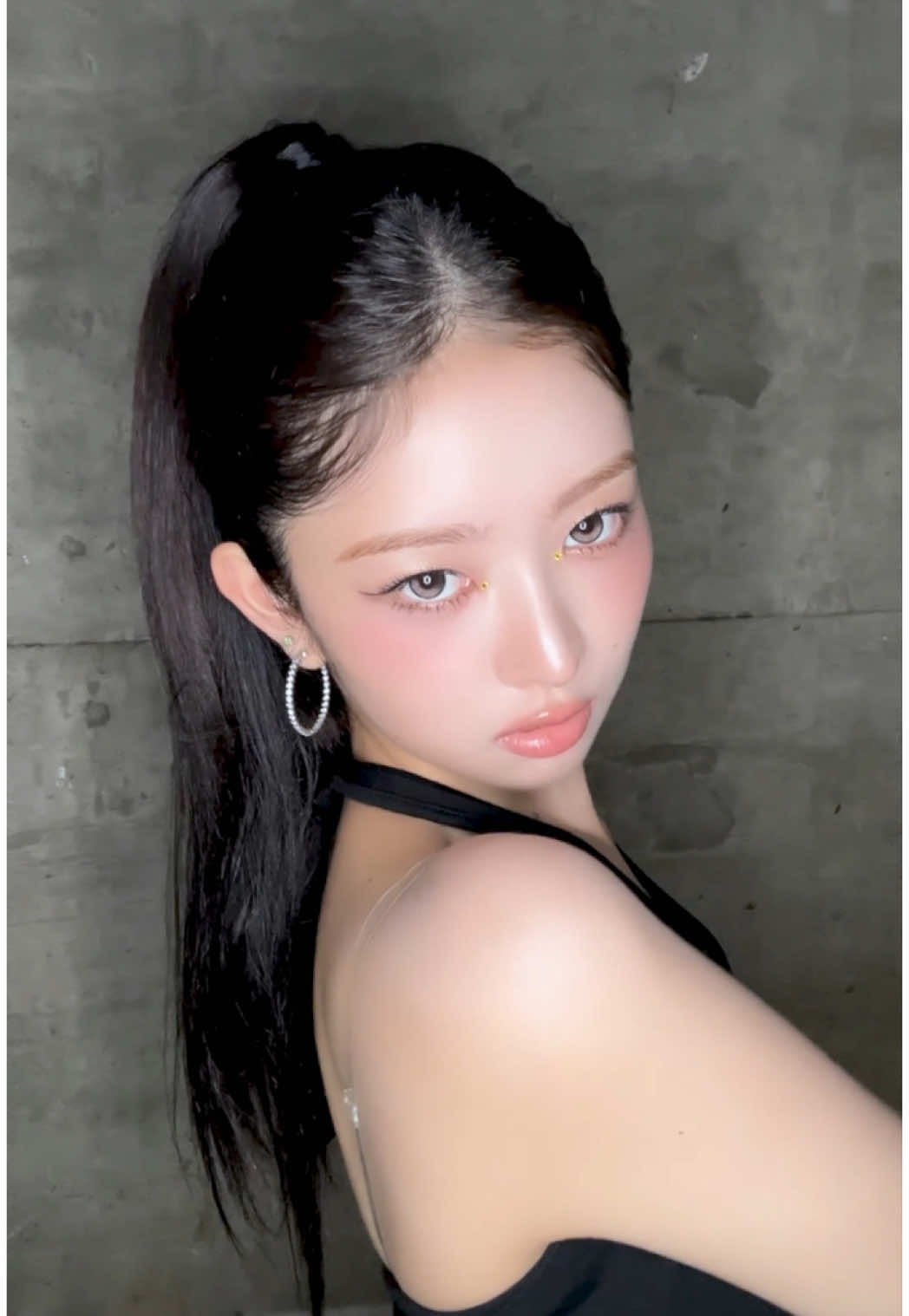 A post by @ive.official on TikTok caption: 👄🩷🩰🎀🖤🕶️🐈‍⬛ #IVE #아이브 #アイヴ #REI #레이 #レイ