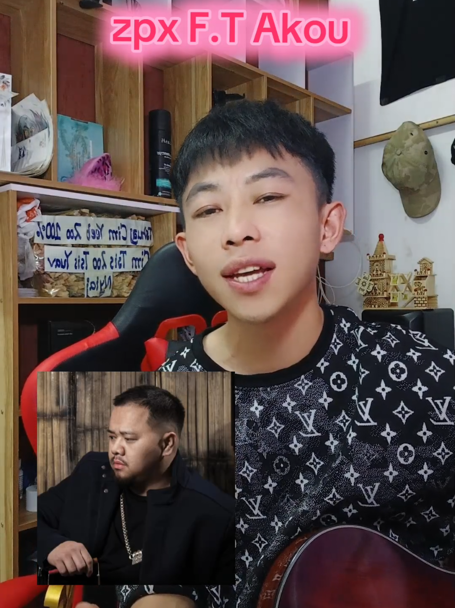 A post by @akou14143sb on TikTok caption: Zpx f.t Akou #akou #hmongrapper #music  @4 v 4 @I viet c @Phij Txws Her 