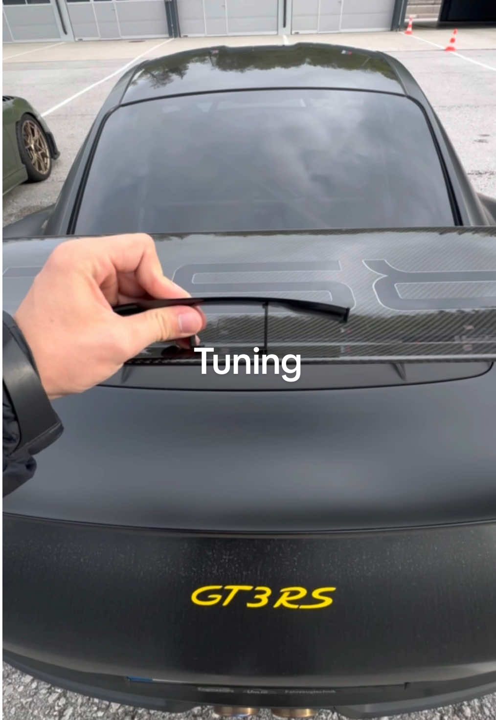A post by @porsche on TikTok caption: Double the wing, double the downforce.🤝 📼@muc.rs. 