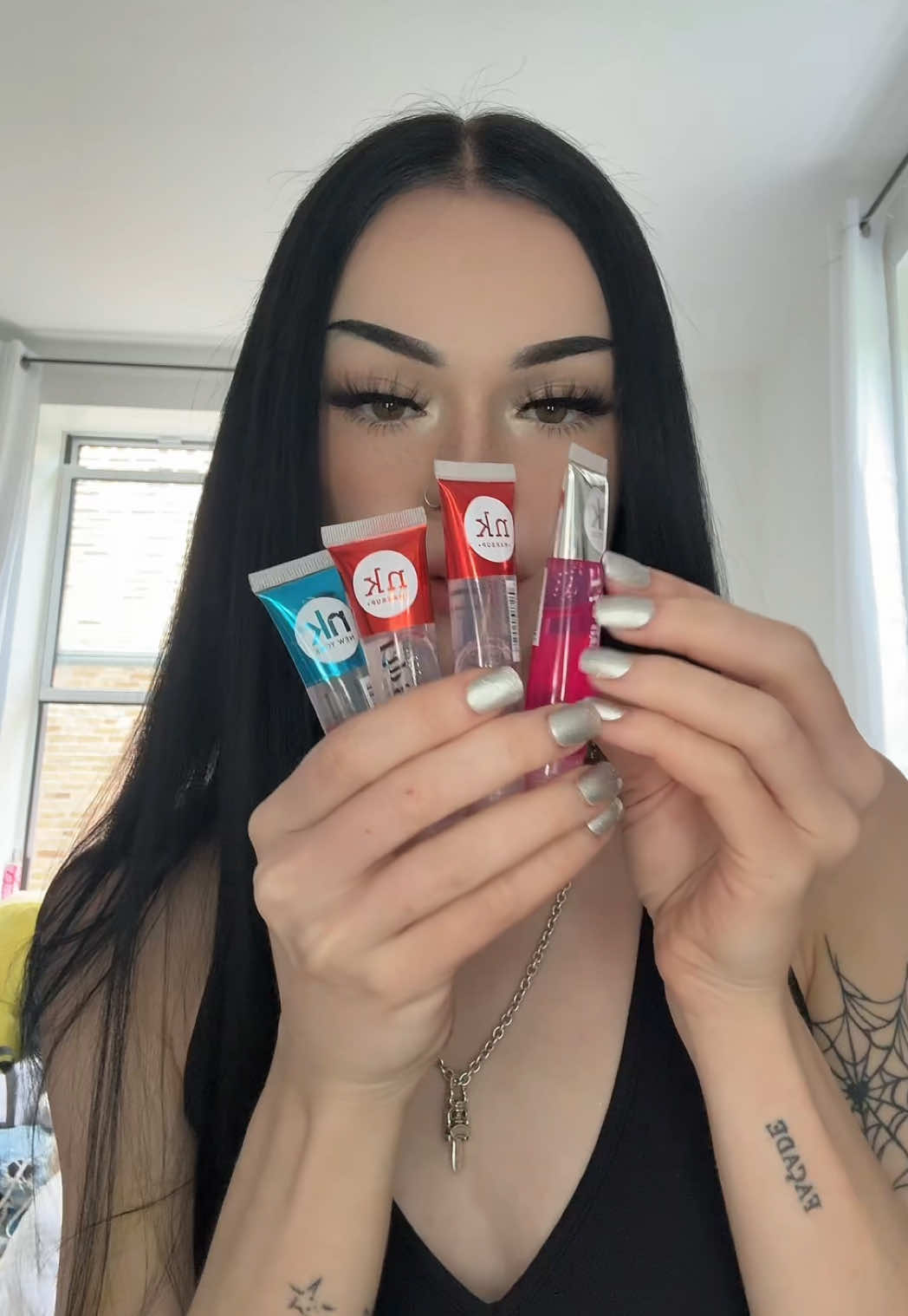 A post by @plutowtf on TikTok caption: ELF HALO LIP GLOSS TREND AHHHH #makeuphacks #wlw 