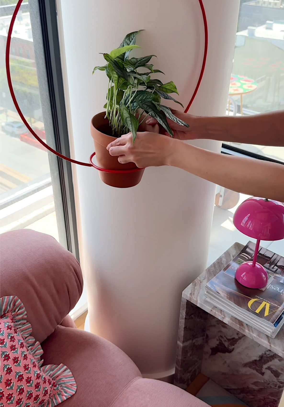 A post by @honeyidressedthepug on TikTok caption: felt like this column needed something 🌱 #dopaminedecor #colorfulhome #diyhomedecor 