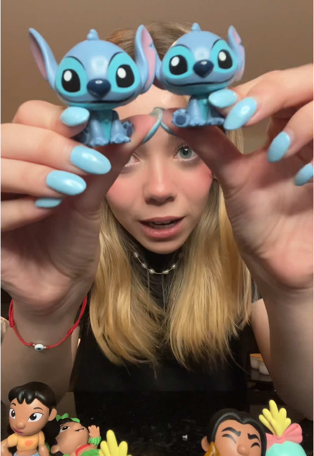 A post by @marcedtc on TikTok caption: abriendo cajitas sorpresa de lilo y stitch JAJAJA #maricheli 