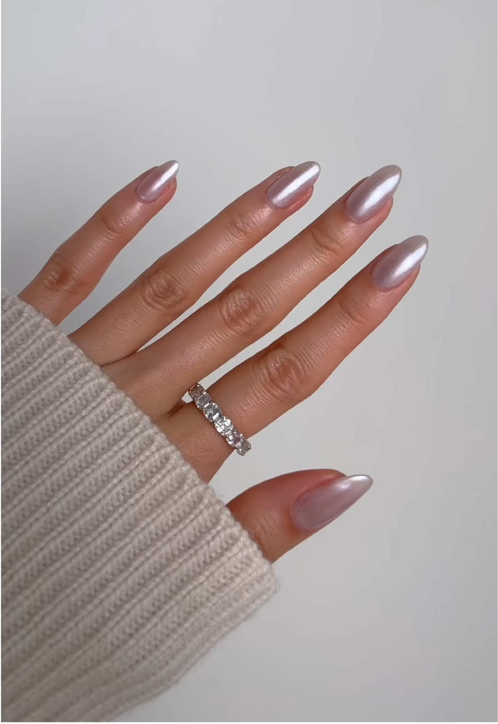 A post by @nailsbyalsn on TikTok caption: matching nails w my @L’Oréal Paris le shadow stick in 'Ice Sparkle' 🪩🩶 using @essie cosmic chrome  ad #essiepartner #chromenails #chrome #nailinspo 