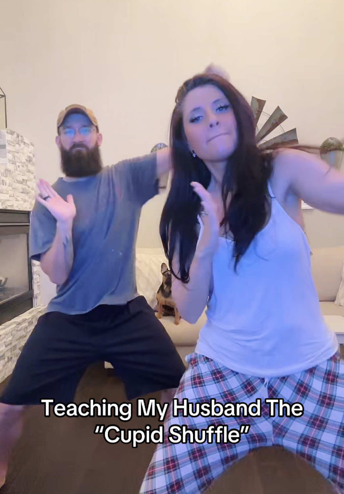 A post by @thugmomog on TikTok caption: WIND IT UP 😂😂 #couples #cupidshuffle #husbandwife #fyp #trending #prank #fypシ 
