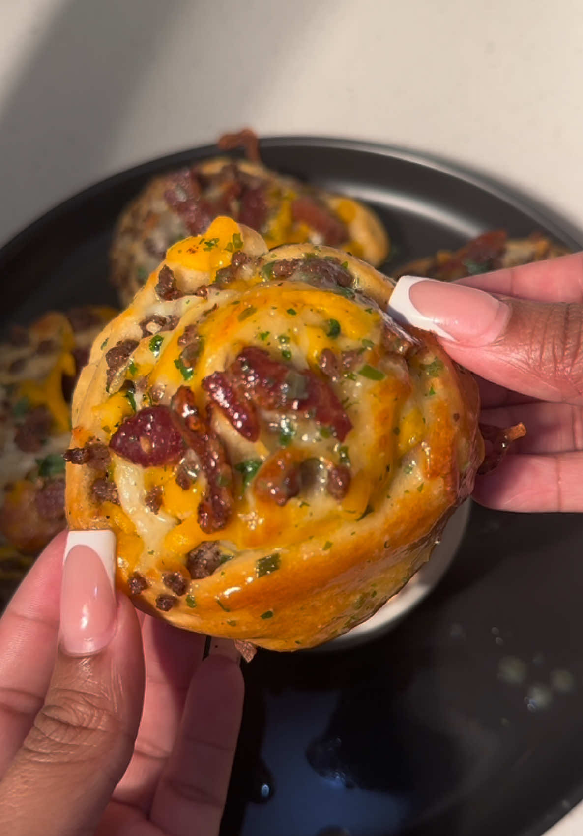 A post by @cookingwithdestiny_ on TikTok caption: Bacon cheeseburger roll ups 😋
