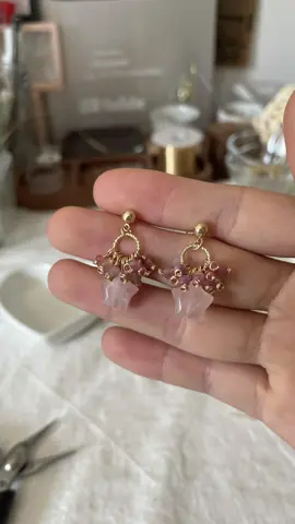A post by @likayjewel_diylilylin on TikTok caption: Rose quartz star with pink tourmaline and strawberry quartz cluster earrings ✨💕#handmadejewelry #tutorial #earrings #earringsoftheday #earringslovers #handmadeearrings #pink #rosequartz #dropearrings #foru #earringcollection 