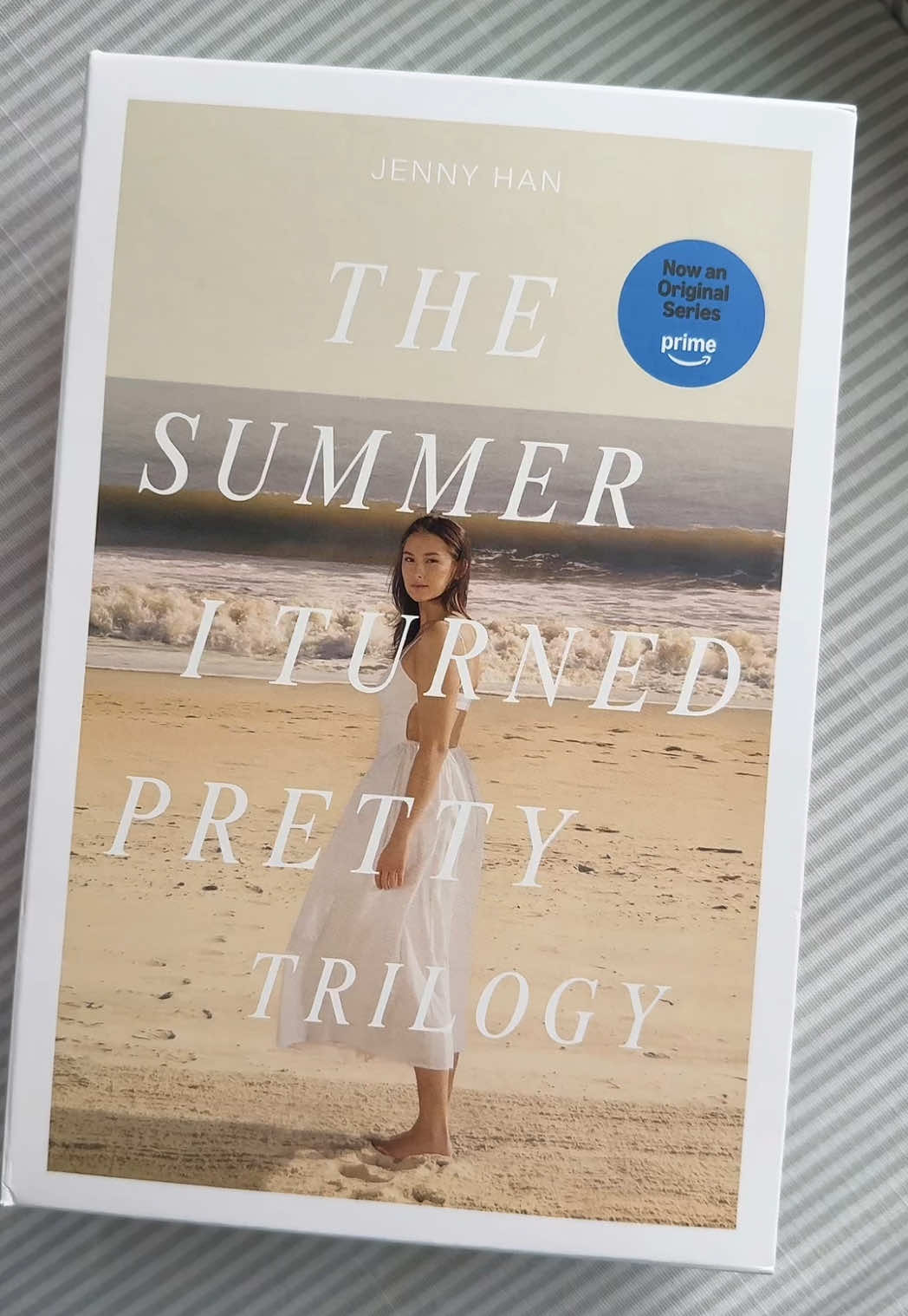 A post by @jennyhan on TikTok caption: You still haven’t read the books yet?! Girl, quit playin #thesummeriturnedpretty Season 3 out July 16 😜 #BookTok 