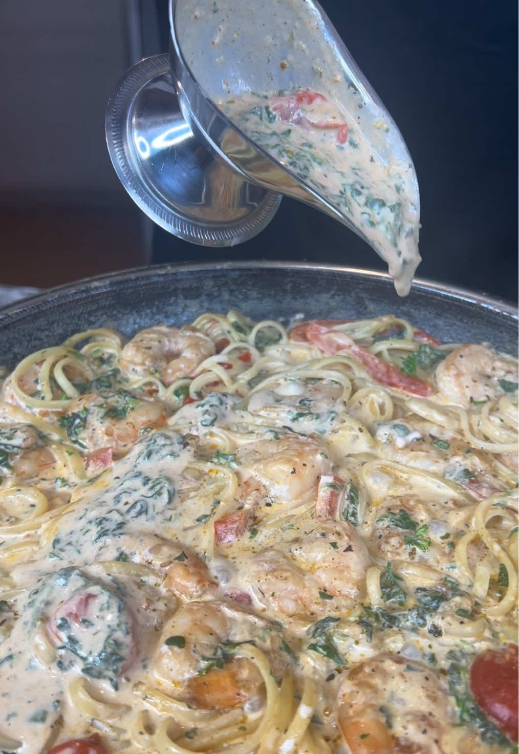 A post by @eatwitzo on TikTok caption: Creamy Tuscan Shrimp Pasta  There’s nothing like a delicious 30 minute meal!  If you want something quick, easy, and flavorful this is it! Swap the pasta for mashed potatoes or rice and you get another banging dish!  Full Ingredient list:  1 lb large/jumbo shrimp  12-15 sliced cherry tomatoes  1/2 small bell pepper sliced  1/2 cup frozen/fresh spinach  1/2 cup chicken broth  1- 1 1/2 cup half & half  1/4-1/2 cup grated Parmesan cheese  1-2 tbsp garlic paste  1-2 tsp garlic powder 1-2 tsp onion powder 1-2 tsp dried oregano  1-2 tsp black pepper 1 tsp cayenne pepper (optional)  1-2 tsp salt (optional)  Preferred pasta choice #tuscanshrimp #pasta #eatwitzo 