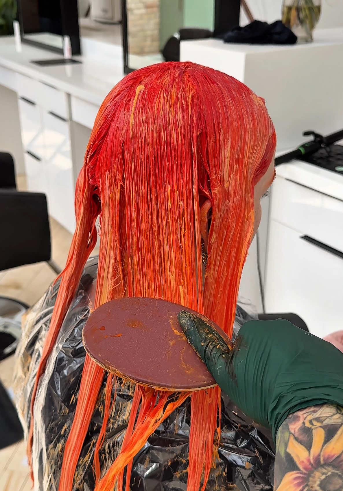 A post by @abbeybrookee on TikTok caption: It was definitely the lunch 🥗 😅 #neonhair #stylists #hairtok #orangehair 
