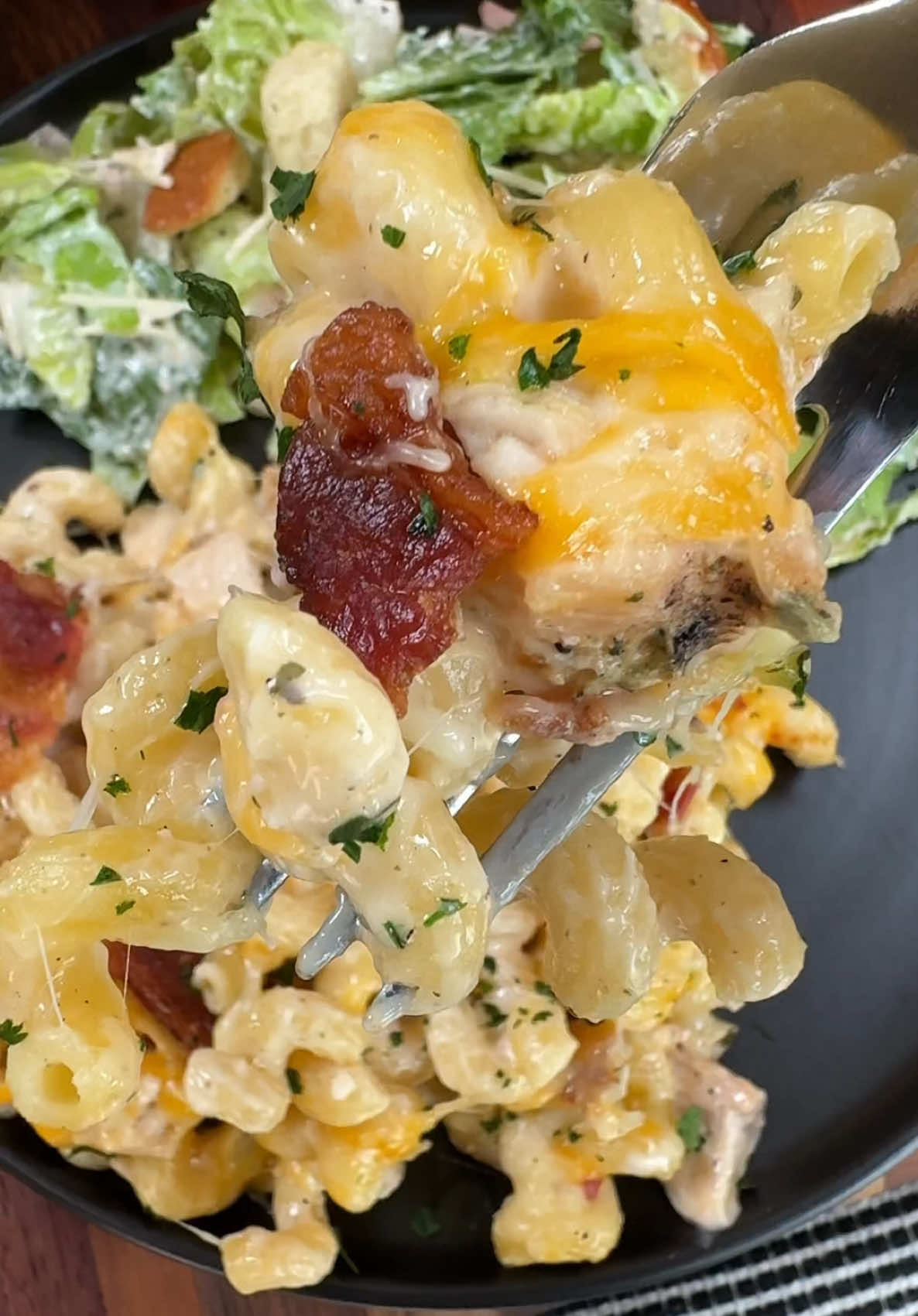 A post by @cookinginthemidwest on TikTok caption: Chicken Bacon Ranch Alfredo Pasta Bake is an easy dinner recipe the whole family likes! INGREDIENTS  1 lb of Cellentani Pasta  1 lb cooked chicken, chopped or shredded  15 oz jar of Alfredo Sauce 1 Ranch seasoning packet  1 cup of shredded cheddar cheese 1 1/2 cups of shredded mozzarella cheese 6 pieces of cooked and crumbled bacon INSTRUCTIONS  Cook at least 6 pieces of bacon and chop into small pieces. Boil one pound of pasta according to the directions on the package. Spray a 9x13 baking dish with cooking spray and set aside. Pour the cooked pasta into the bottom of the baking dish. Add 1 lb of cooked chicken, one jar of Alfredo sauce, and a ranch seasoning packet. Add some of the mozzarella, cheddar cheese, and some of the bacon and stir everything together well.  Top with a little bit more cheddar cheese, mozzarella cheese, and crumbled bacon. Bake at 375 degrees F for about 15-20 minutes. Serve and enjoy! #easyrecipes #dinner #pasta #chickenalfredo 