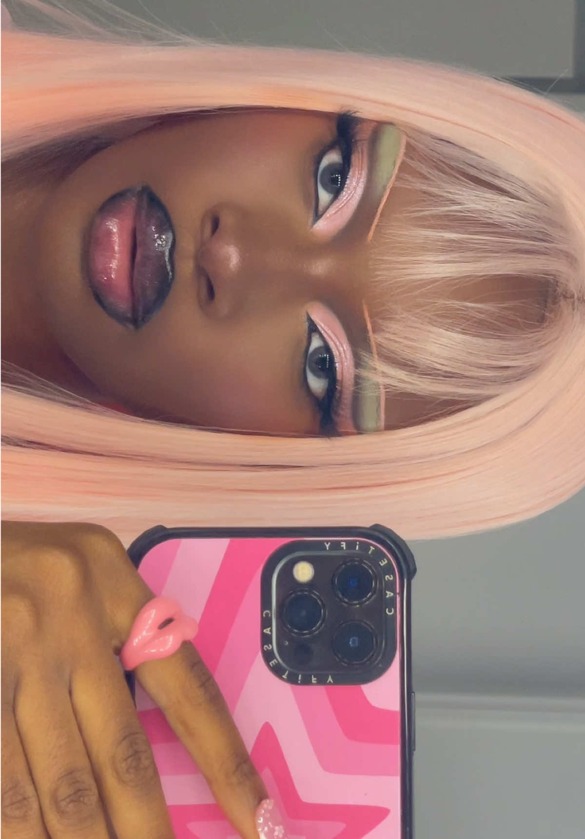 A post by @ on TikTok caption: honestly can say my base is now unstoppable thanks to my new holy trinity 🙏🏾  @DanessaMyricksBeauty blurring balm tint  @narsissist radiant creamy concealer  @Huda Beauty cinnamon bun powder   #fyp #makeupinspo #eyemakeup #pinkeyeshadow #basemakeup 