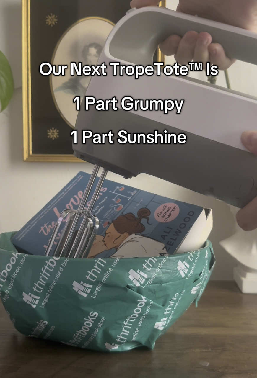 A post by @thriftbooks on TikTok caption: Black cat, meet labrador retriever. Introducing our latest TropeTote™, featuring a grumpy x sunshine design by @Bibliostyles. Click the link in bio to discover our latest limited addition to the Trope Trove™ before it’s gone.#grumpysunshine #grumpyxshunshine #tropetote #thriftbooks #readersgonnaread #readerlife 