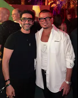 A post by @ahmedhelmy on TikTok caption: ضريبه الصداقه 😂 @Amr Diab 