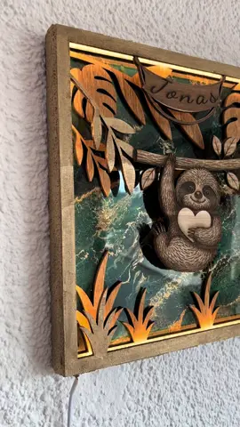 A post by @christine1990_ on TikTok caption: ✨ Neu im Shop ✨ Zwei neue beleuchtete Wandbilder aus Holz & Epoxidharz – handgefertigt mit ganz viel Liebe zum Detail und personalisierbar mit deinem Wunschnamen. 🌿 Jedes Stück ein Unikat 💡 Mit integrierter LED-Beleuchtung 🖐️ Lasergraviert & gegossen 🎁 Perfekt als Geschenk oder für dein Zuhause 👉 Jetzt erhältlich in meinem Onlineshop: www.epoxidharzkunstwerke.de (📍 Link in der Bio) Welches Motiv würdest DU dir wünschen? 🦁🦉🌸 Bei Sonderanfertigungen schreib mir gerne eine Nachricht! #personalisiertegeschenke #faultier #leopard #epoxidharz 
