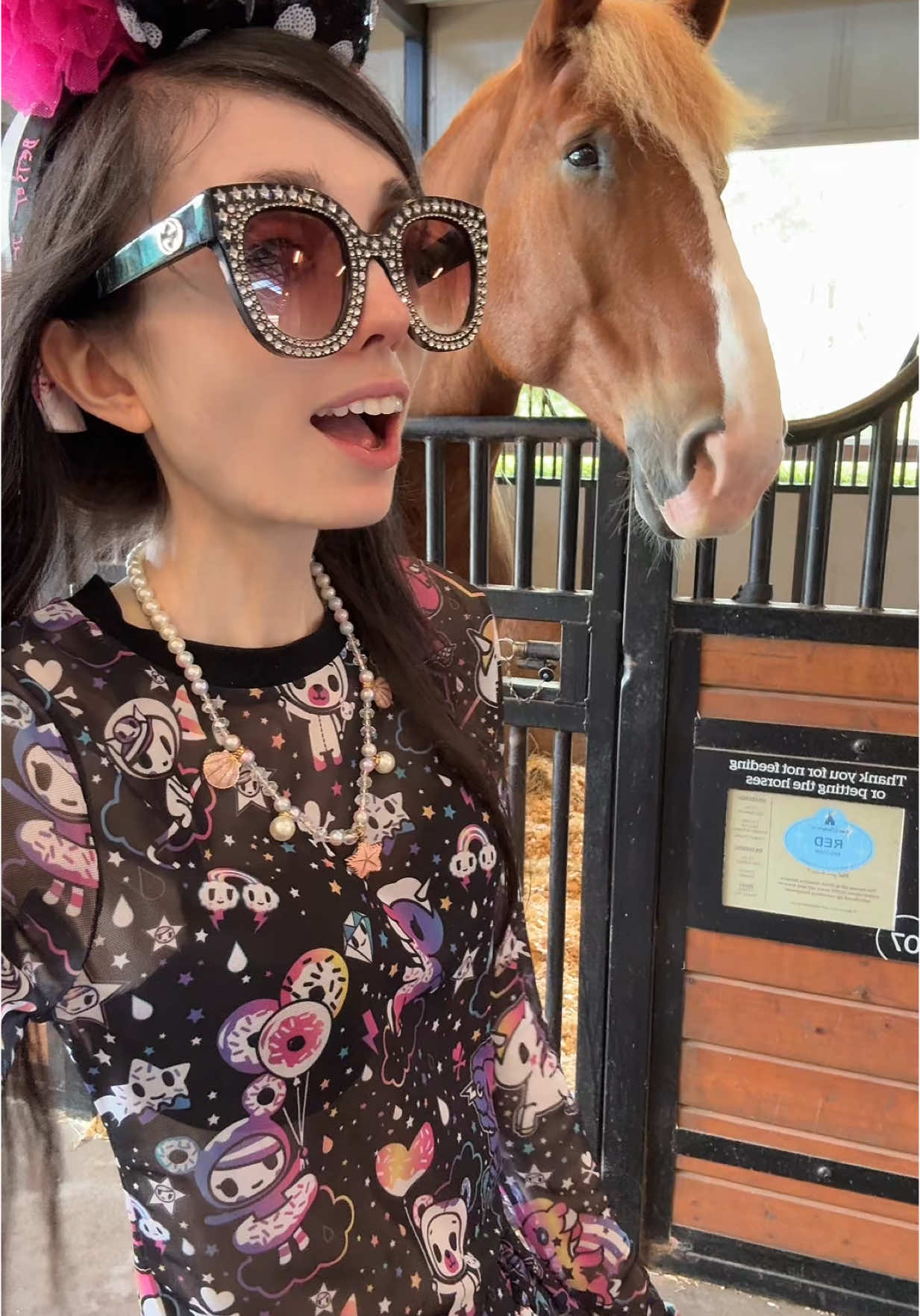 A post by @eugeniaxo on TikTok caption: One of the most peaceful moments of my Disney trip… 🐴🌿  Spending time with Red and Leo felt like pure magic. ✨ #disney #disneyworld #fortwilderness #disneymagic #horselovers #disneyvlog #tiktoktravel #magicalmoments 