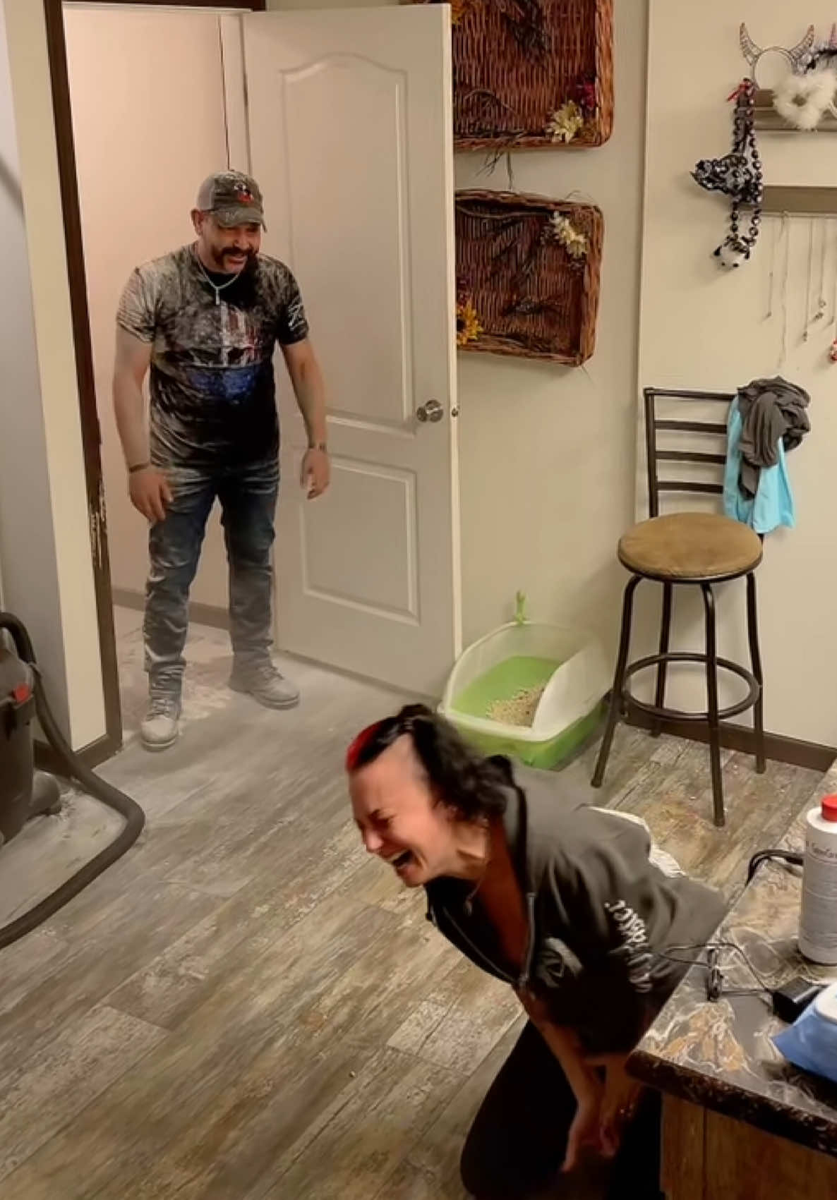 A post by @theycallmetoby2 on TikTok caption: Never trust a woman with a tripod randomly set up in the room