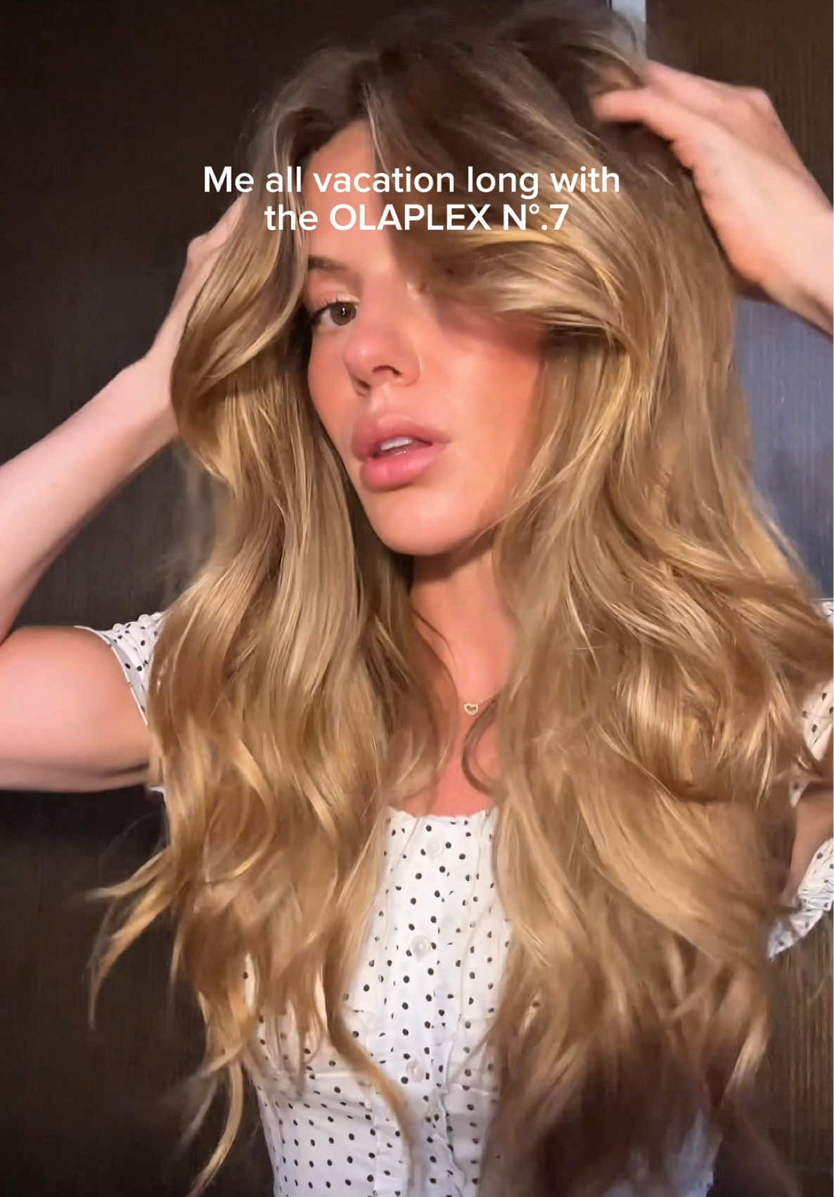 A post by @anggwells on TikTok caption: @Olaplex N°.7 Bonding Oil on repeat 🌺 & I love anything that comes in a mini size for travel #olaplex #olaplexpartner #hairoil