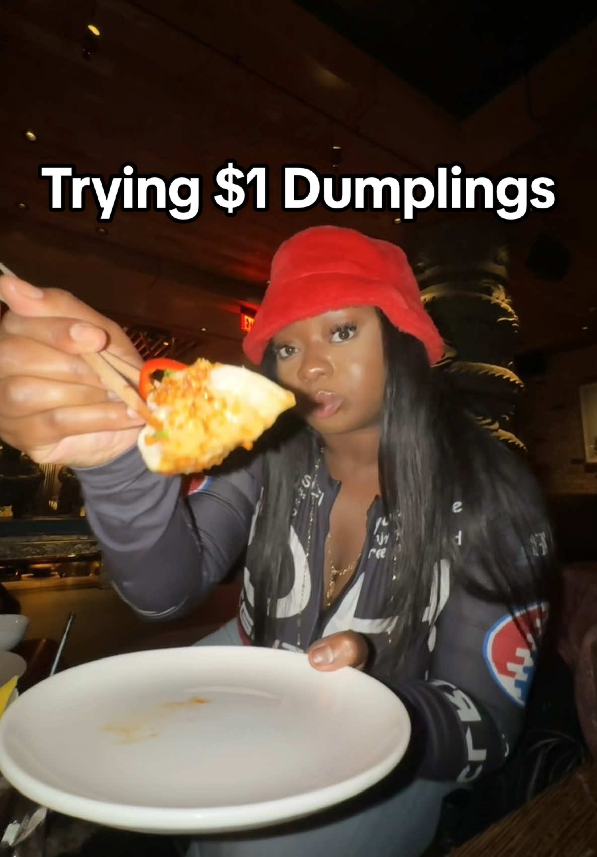 A post by @therealtati on TikTok caption: Trying $1 dumplings at TAO #tatitriesthings 