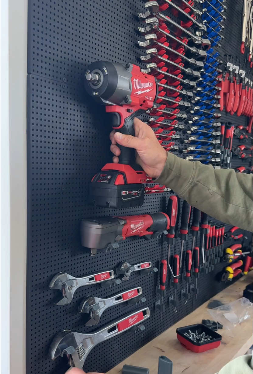 A post by @dustylumberco on TikTok caption: Getting close to finishing up this section of the @Milwaukee Tools wall with the @Toolgrid vertical tool organizing system 