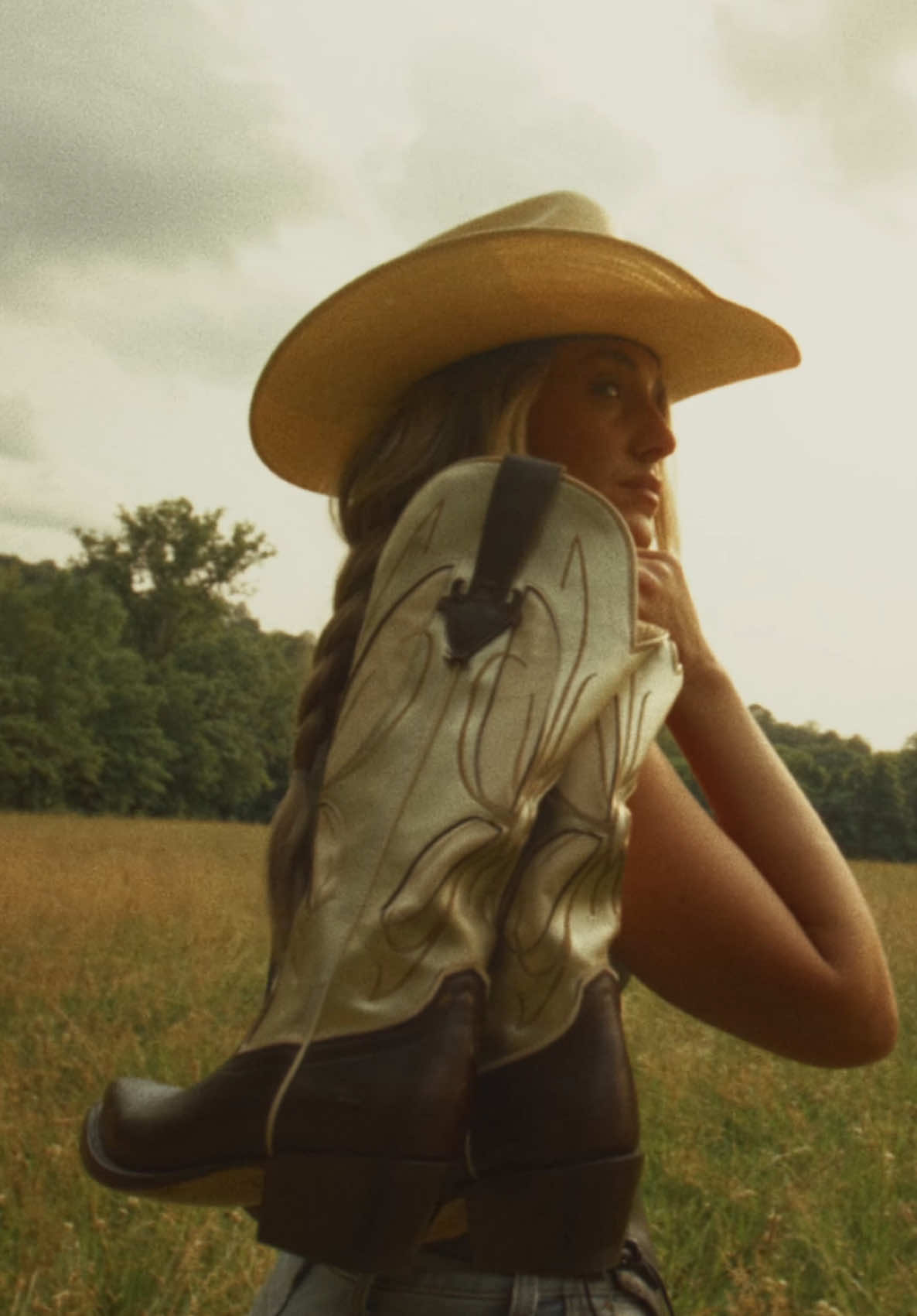 A post by @laineywilson on TikTok caption: Golden West Boots is LIVE! This brand is for the trailblazers, the dreamers, the wayward souls, and wild hearts. If someone could walk a mile in your boots, what would they say about you? 💥NASHVILLE💥 The @Golden West Pop-Up Shop is open at Lainey Wilson’s Bell Bottoms Up! Snag your boots for CMA fest. Limited edition, while supplies last!🌟 #GoldenWestBoots #AStoryInEveryPair #WhatsYours www.goldenwestboots.com