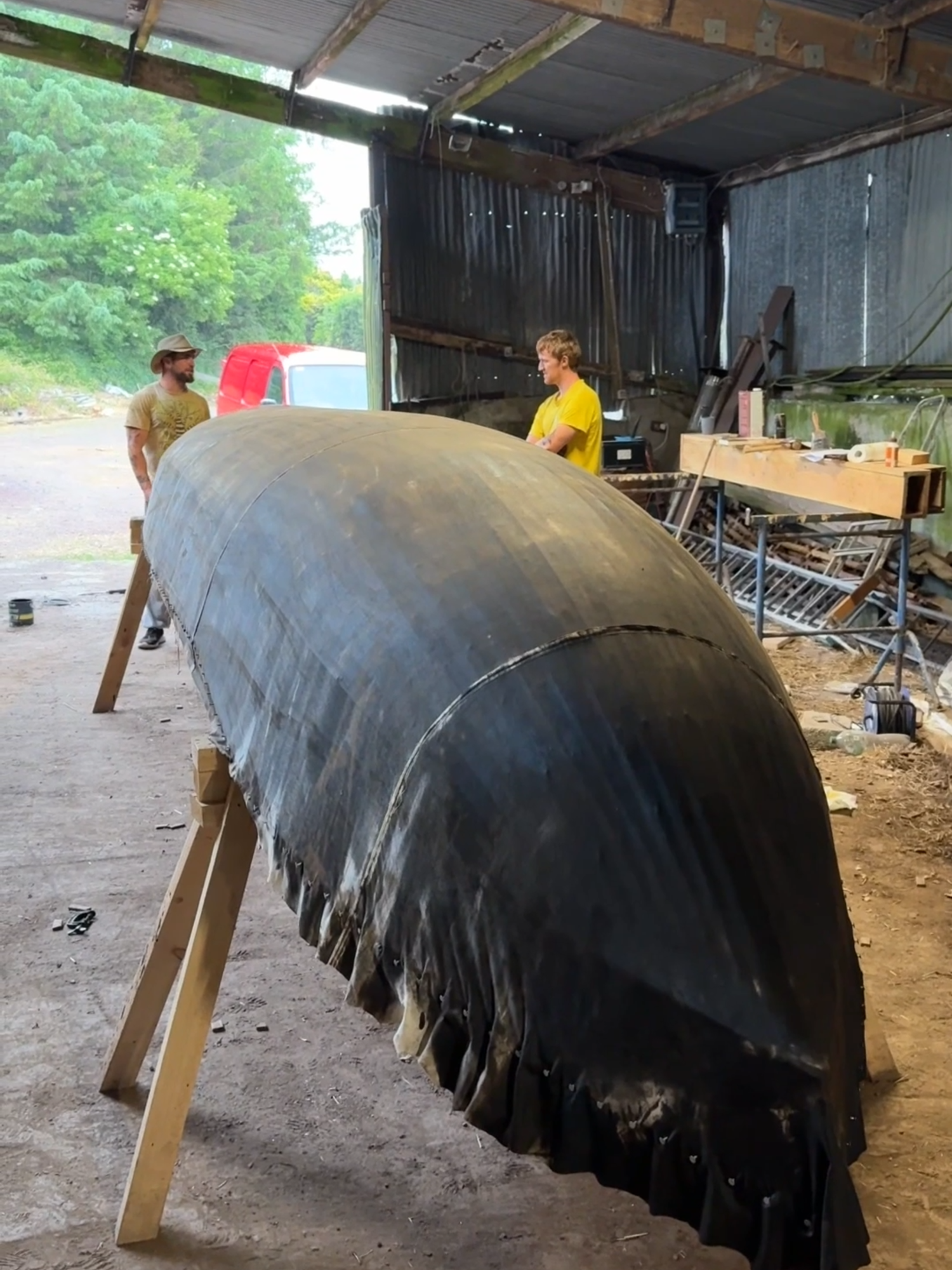 A post by @pintofplane on TikTok caption: Painting The Hull #ireland #woodwork #currach #painting #craft #boatbuilding