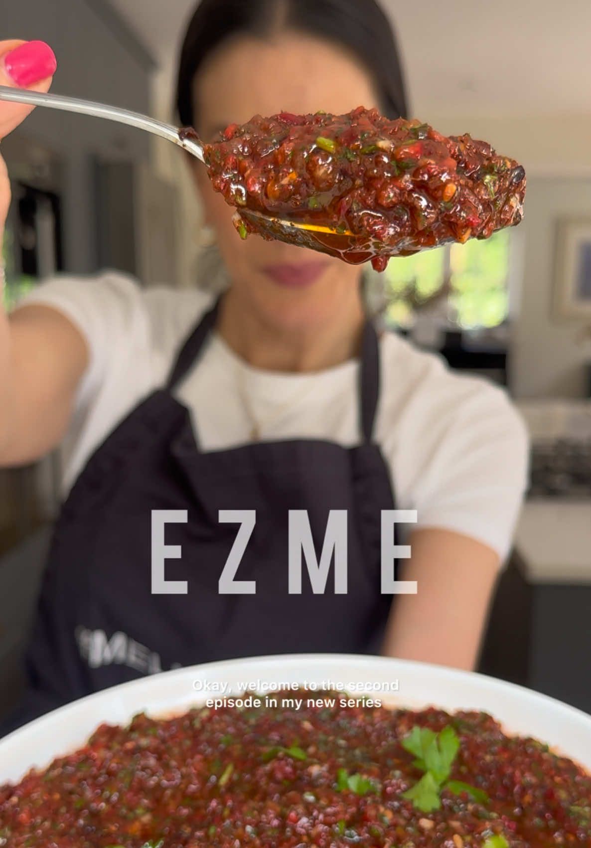 A post by @melizcooks on TikTok caption: Meliz Cooks Good Food: Episode 2, Ezme.  This a wonderful side dish / dip / salad to have on your dinner table for Kurban Bayramı / Eid-al-Adha. Perfect to spoon into and onto lots of lovely delicious things. Ezme means “to crush” and it refers to the crushed texture of this salad. Authentic ezme is very finely hand-chopped, but feel free to use a food-processor if you have one, like I have suggested in the recipe – you will get a much finer texture but still keep it textured. It keeps well in the fridge to enjoy over the next few days with friends and family 🌙 ⭐️  Full recipe on the @goodfoodeveryday website. Link in bio.  * 2-3 large  ripe tomatoes quartered, around 400g * 1 medium kapya biber / Romano / Red pointed pepper and roughly chopped  * 1 medium sivri biber or small green chilli, deseeded and roughly chopped * 1 small  onionroughly chopped * 2 large garlic cloves crushed * 25g fresh flat-leaf parsley * 2 tbsp red pepper paste * 1 tbsp tomato purée * 2 tbsp pomegranate molasses * 1 tbsp pul biber * 2 tsp sumac * 1 tbsp dried mint * 60ml extra virgin olive oil #melizcooks #ezme #meze #mezze #bayram #recipe #tomatoes #peppers #capsicum #evoo #pomegranatemolasses #eid #goodfood #melizcooks