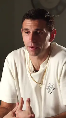 A post by @ballondor on TikTok caption: Emiliano Martinez vs. Randal Kolo Muani: the last-minute save that changed the 2022 World Cup final between Argentina and France. Our two-time Yashin Trophy winner, back on the pitch today against Chile, shared his memories of that iconic moment with us in 2023. One word to describe it? #BallondOr #sportstiktok 