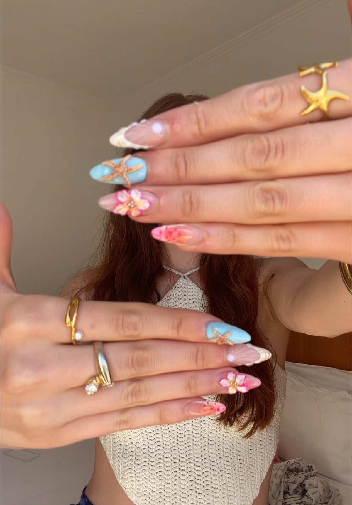 A post by @savsgotcake on TikTok caption: Vacation Nails🐚✨🌸🧡 #nails #nailart #nailinspo 