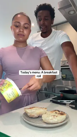 A post by @mudyandshamy on TikTok caption: Making my bf a breakfast roll #bakedbeans #breakfast #breakfastideas #friedegg 