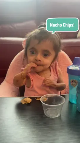 A post by @ourlittlemms on TikTok caption: The love relationship these girls have with food and snacks is just something else! 😂❤️ #foodie #foodtiktok #snack #nachos #chips #crunch #munch #yummy #asmr #eating #twins #sisters #adorable #cute #fyp #foryoupage 