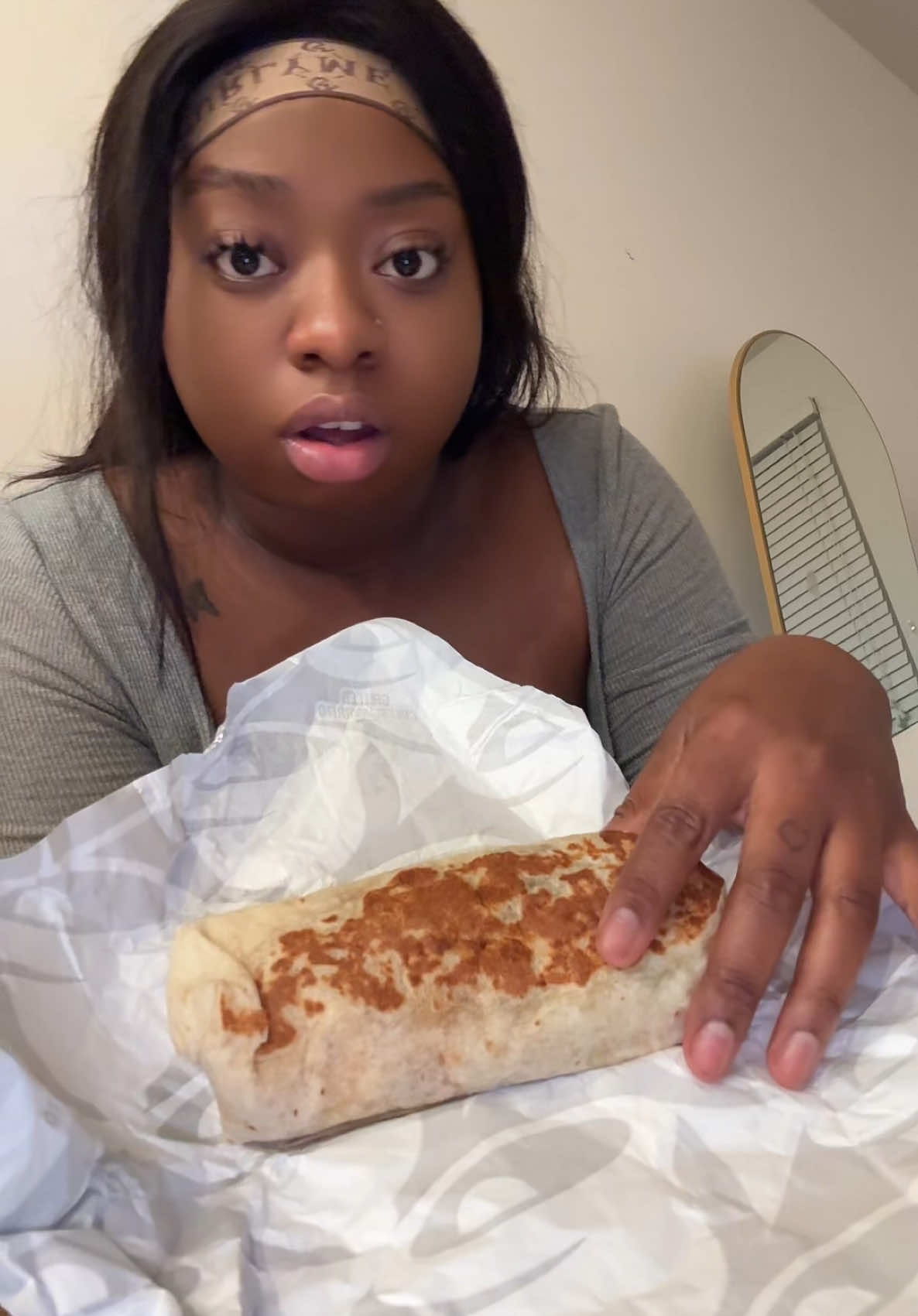 A post by @therealtati on TikTok caption: Eating Taco Bell on a Thursday night. Life’s good