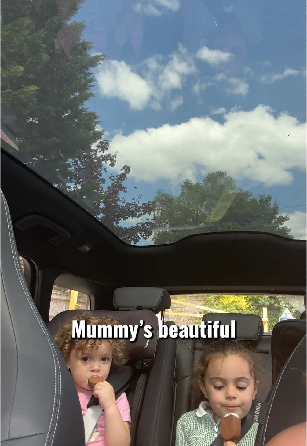 A post by @poppyhollins on TikTok caption: Best part of my day, those after-school car chats with my girls (Franks eating her ice cream is a vibe 😂)