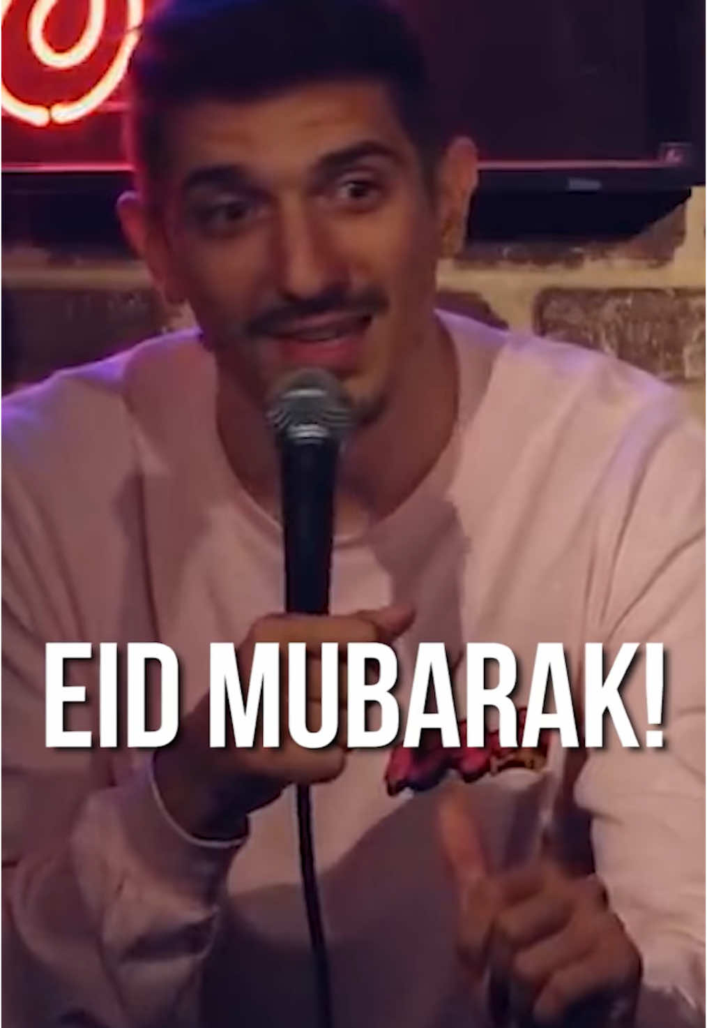A post by @theandrewschulz on TikTok caption: Eid Mubarak 🌙🤲🏽 Wishing barakah on your house, your plate, and your WhatsApp group chat ❤️ #andrewschulz #standupcomedy #comedy