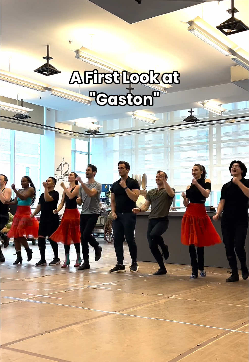 A post by @disneyonbroadway on TikTok caption: My, what a guy! 💪 Stephen Mark Lukas (Gaston) and Harry Francis (Lefou) lead the company of BEAUTY AND THE BEAST as they rehearse “Gaston.” #broadway #rehearsals #disney #beautyandthebeast #fyp 