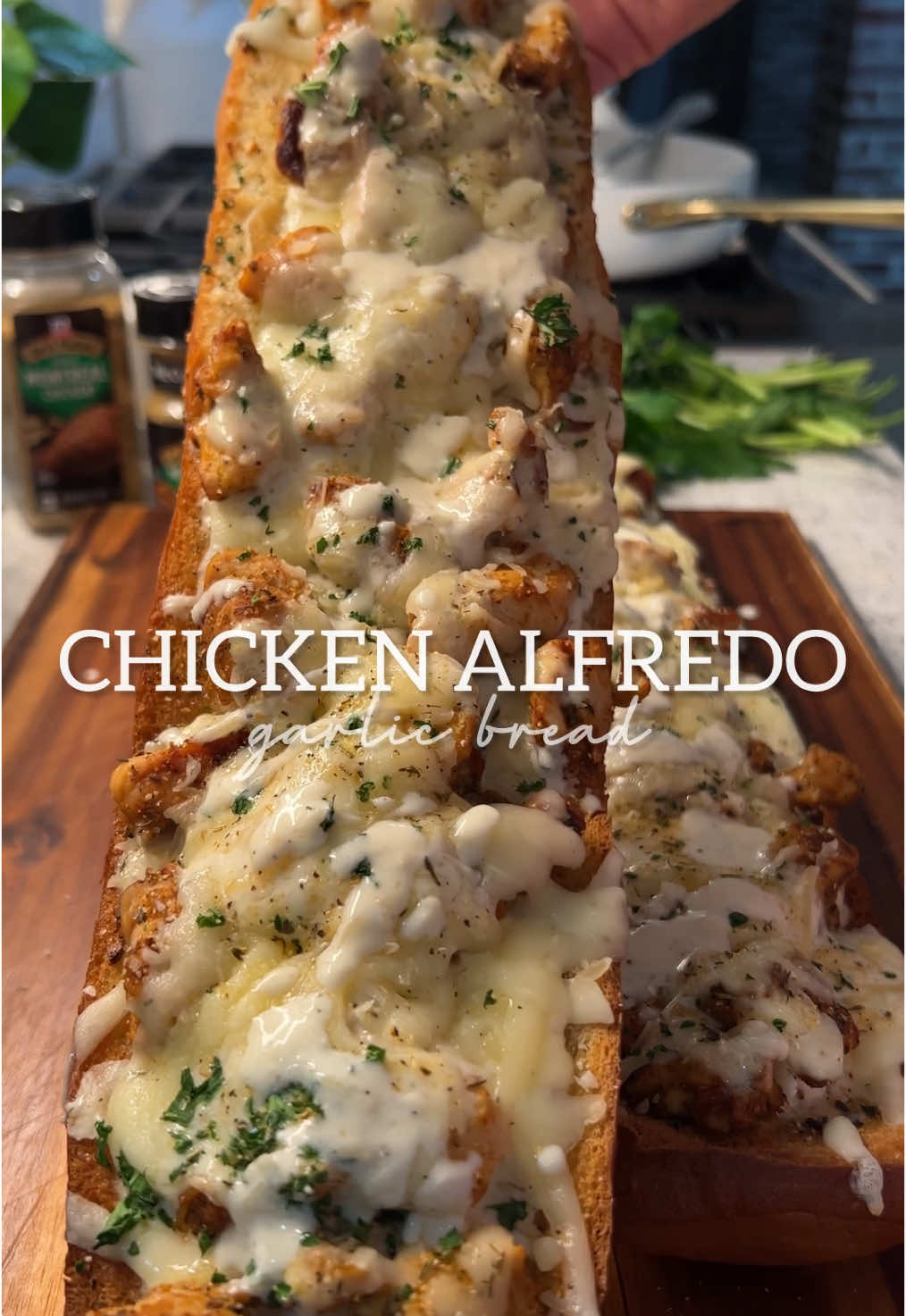 A post by @britscookin on TikTok caption: This Chicken Alfredo Garlic Bread is DELICIOUS!  And thanks to @McCormick Spices Grill Mates CLUB Size Montreal Chicken, I don’t have to worry about running out—whether I’m making this or my garlic parm skewers all summer long! Ingredients: For the Chicken: 	•	1½ lbs chicken breast, cut into bite-sized pieces 	•	1 tbsp GrillMates Montreal Chicken seasoning 	•	1 tsp paprika 	•	1–2 tbsp bacon grease (or olive oil) for cooking For the Garlic Bread: 	•	1 loaf French bread, halved 	•	½ stick butter, melted 	•	1 tbsp minced garlic 	•	1 tbsp chopped parsley 	•	1 tsp garlic salt For the Alfredo Sauce: 	•	2 cups heavy whipping cream 	•	1 stick butter 	•	1 cup grated Parmesan cheese 	•	½ tsp garlic salt (or to taste) 	•	½ tsp black pepper 	•	½ tsp GrillMates Montreal Chicken seasoning (optional, to taste) To Assemble: 	•	Cooked chicken 	•	Alfredo sauce 	•	Shredded mozzarella cheese 	•	Grated Parmesan 	•	Chopped parsley for topping ⸻ Instructions: 	1.	Cook the Chicken: Season chicken with Montreal Chicken seasoning and paprika. Heat bacon grease (or olive oil) in a skillet over medium heat. Cook chicken until golden and cooked through. Set aside. 	2.	Make the Garlic Butter: Mix melted butter with minced garlic, parsley, and garlic salt. Spread over halved French bread and bake at 425°F for 10 minutes or until toasted. 	3.	Make the Alfredo Sauce: In a saucepan, combine heavy cream and butter over medium heat. Once it starts bubbling, whisk in Parmesan cheese. Season with garlic salt, black pepper, and more Montreal Chicken if desired. Stir until smooth and creamy. 	4.	Assemble the Garlic Bread: On the toasted bread, layer Alfredo sauce, cooked chicken, more Alfredo sauce, mozzarella, a little Parmesan, and parsley. 	5.	Bake: Return to the oven and bake at 425°F for 8–10 minutes or until the cheese is melted and bubbly. Find the full recipe in my bio and grab the club size at @Sam’s Club! #McCornmickPartner 