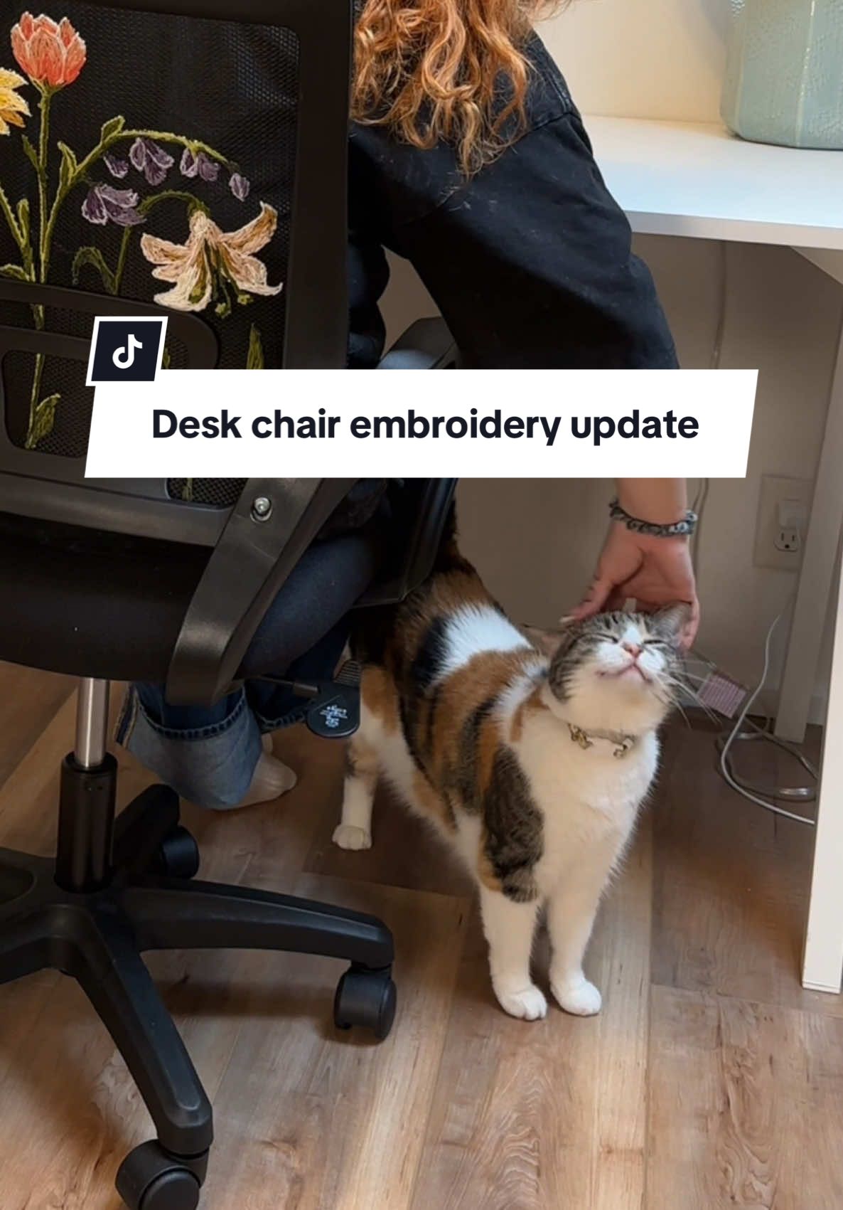 A post by @emilyrayna on TikTok caption: Replying to @Liz Foreback the flowers are complete! #diyproject #embroidery #upcycle #wfh #diyhomedecor #workfromhome 