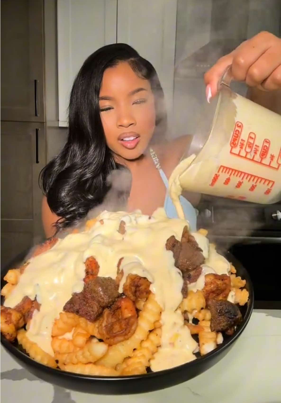 A post by @cookingwithdestiny_ on TikTok caption: Loaded surf & turf fries 🤤