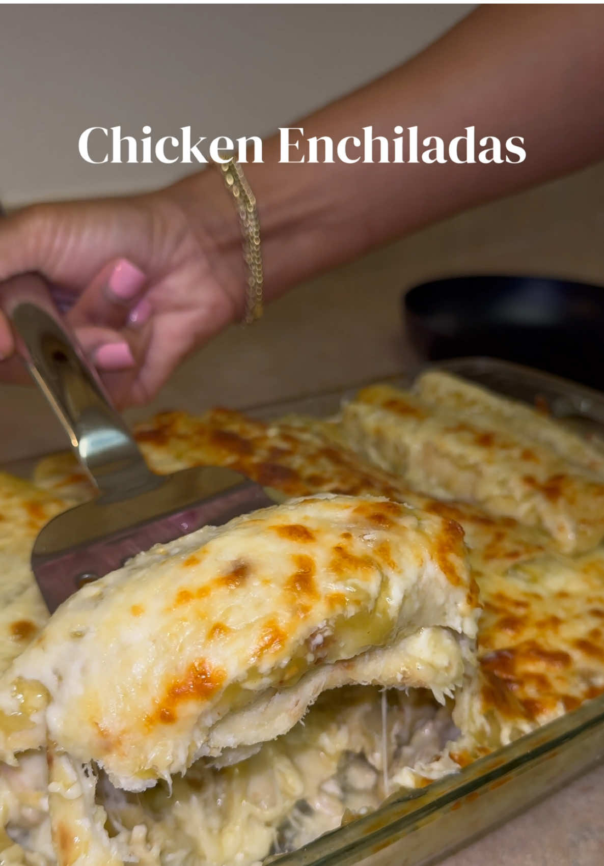 A post by @mishlovee on TikTok caption: Chicken Enchiladas came out absolutely delicious ❤️ Ingredients: - 5 chicken breast  - 1 White onion - 2 Bay leaves - La Banderita Flour Tortillas  - 2 cans of Las Palmas Green chile Enchiladas Sauce  - Supremo chihuahua cheese & Monterey cheese  - Seasoning: salt, pepper, onions, garlic powder, chicken bouillon and cumin powder  *Boil the Chicken -In a large pot, boil chicken breasts with 1/2 onion, chicken bouillon, and 2 bay leaves for 20–30 min until tender. -Save 1 cup of broth, then shred the chicken. *Make the Filling -In a skillet, sauté the other half of the diced onion in olive oil (3–5 min). -Add shredded chicken, 1 can of enchilada sauce, and reserved broth. -Season with garlic powder, onion powder, cumin, salt & pepper. -Season again lightly and mix well. -Cover and simmer on low for 20 min, then let cool for 10 min. -Warm a second can of enchilada sauce in a saucepan; let cool slightly. *Prep Tortillas & Cheese -Lightly warm tortillas until soft. -Mix cheeses in a bowl. *Assemble -Spread enchilada sauce in the baking dish. -Dip tortillas in sauce, add chicken and cheese, roll, and place seam-side down. -Add sauce and cheese on top. Repeat for more layers if needed. *Bake -Bake at 400°F for 5–10 min, until cheese melts. -Broil 3–5 min for a golden top—watch closely. That’s it! Easy and delicious enjoy 🥂 #Chickenenchiladas