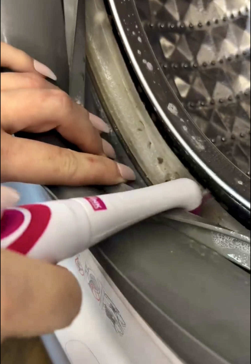 A post by @cleanwithpinkstuff on TikTok caption: Your sign to grab your scrubber this Saturday! 🤭💖 Washing machine clean complete 💪 with @Jennie and The Pink Stuff Scrubber ✨ @The Laundry Hub  #thepinkstuff #pinkstuff #cleantok #cleaning #cleaningmotivation #cleaninghacks #springcleaning #washingmachine 