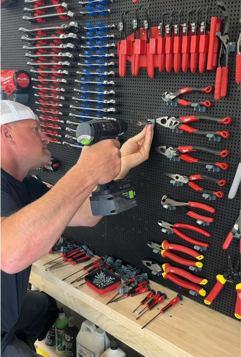 A post by @dustylumberco on TikTok caption: I really like how this @Toolgrid vertical tool wall system makes it so you can completely customize the placement of all your tools. This section of the @Milwaukee Tools wall is now almost complete 👍