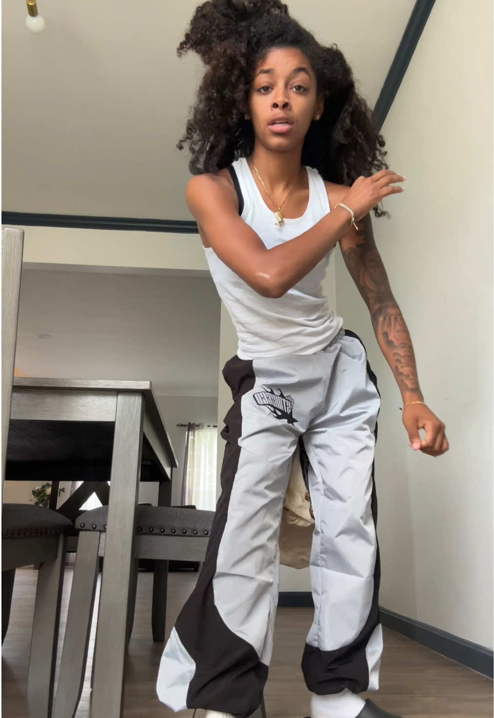 A post by @curlyhairniyahh on TikTok caption: Suits will soon be on my website! Stay tuned! 🙈