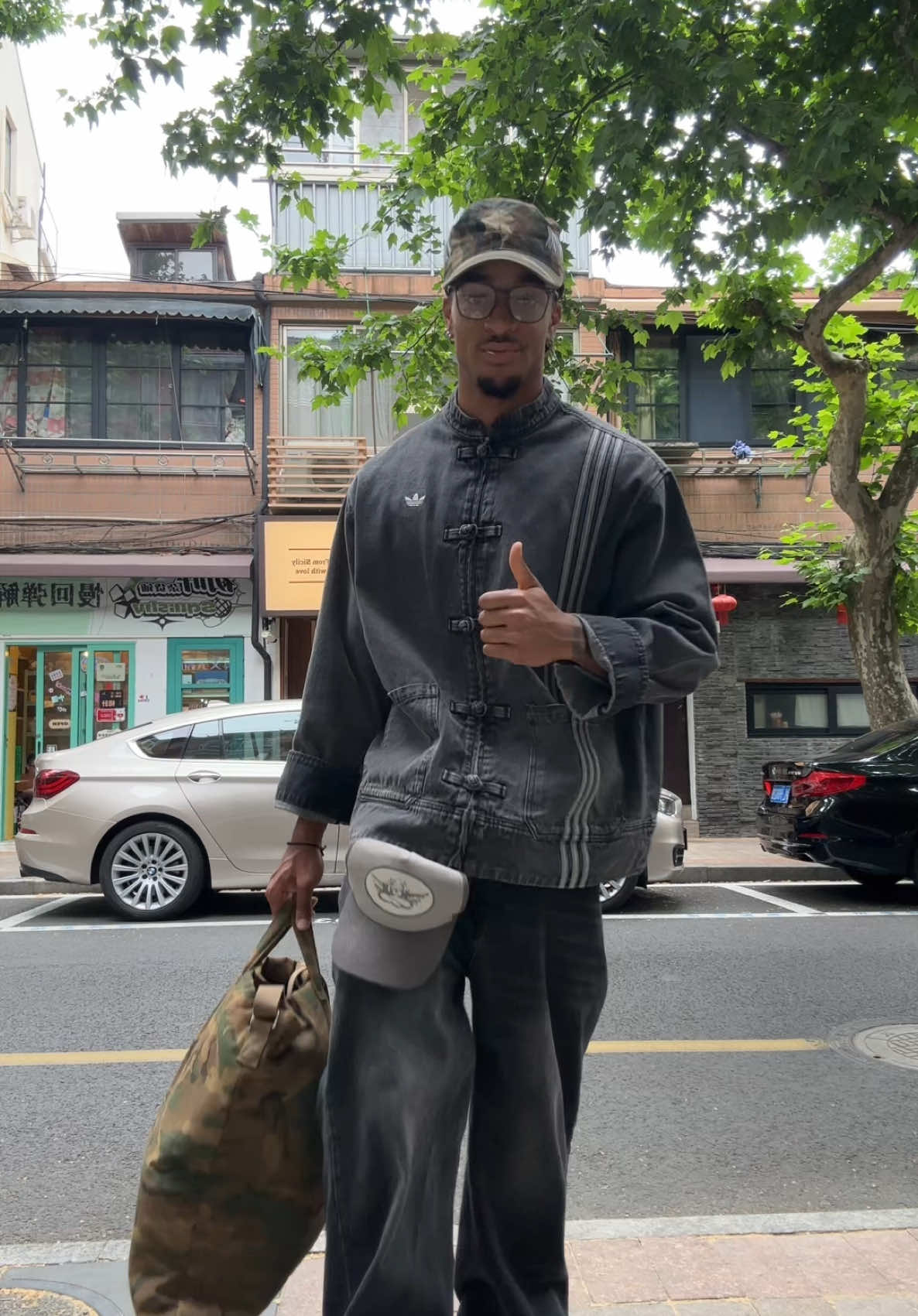 A post by @jeanvictorm on TikTok caption: Fit check in 🇨🇳