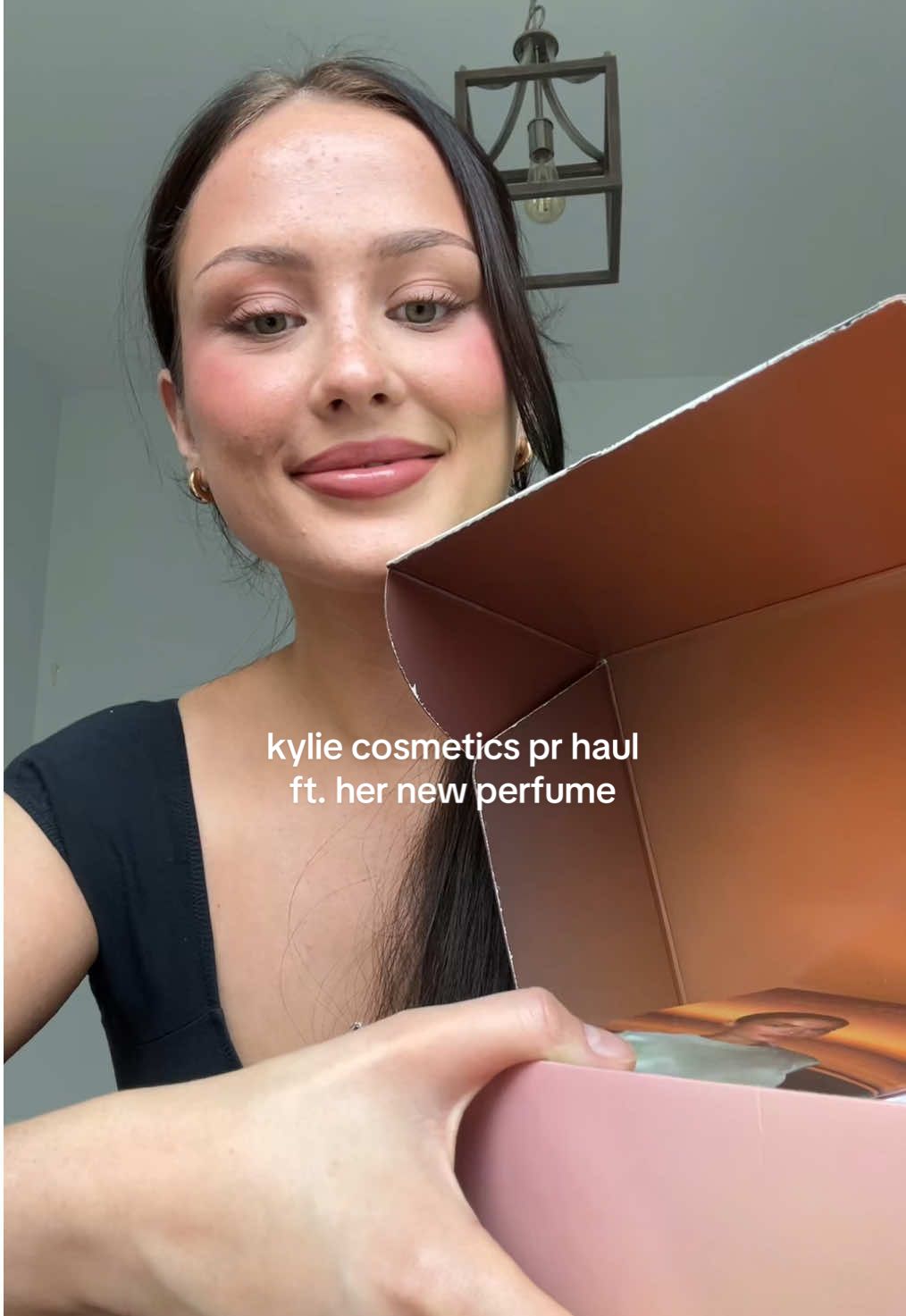 A post by @shastina on TikTok caption: I can’t stop smelling myself now wow @Kylie Cosmetics @Kylie Jenner thanks so much 💋 #kyliecosmetics #cosmicperfume 