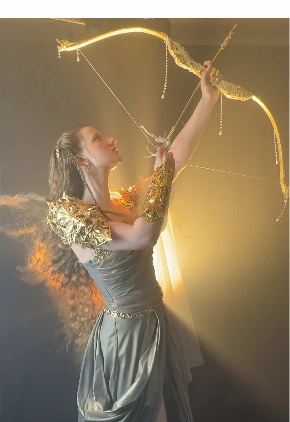 A post by @emackelder on TikTok caption: Taste of the glamorous life 🏹 @Sidney Rubino @mag!!! @Chelsea Sinks @amarancreators @fauwn_fantasy @Griff #goddess #warrior #mothology #bts #fyp 