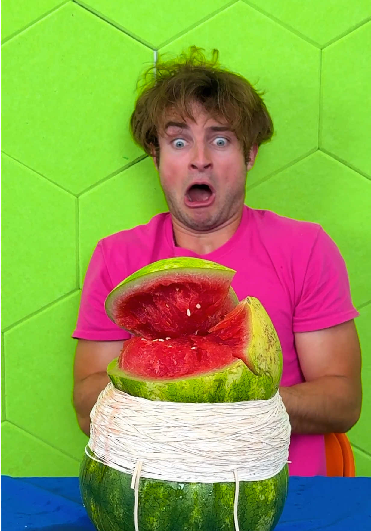 A post by @topperguild on TikTok caption: Rubber Bands vs Watermelon!