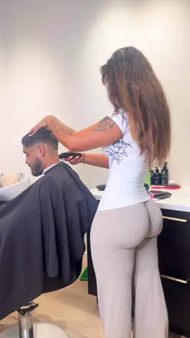 A post by @evanamariaaa on TikTok caption: mid fade with beard & texture! 🫶🏻 #fyp #femalebarber 